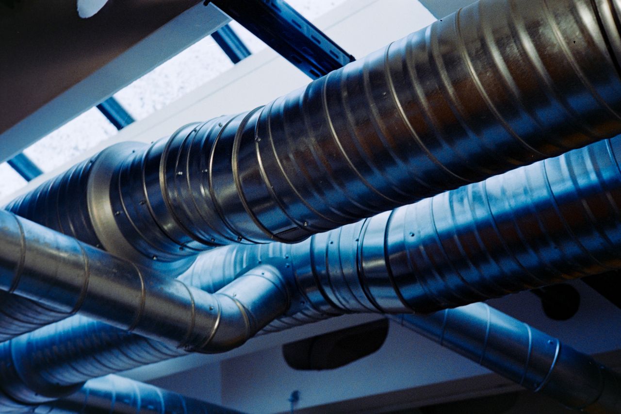 Crafting Captivating Headlines: Your awesome post title goes here Close-up of a modern metallic ventilation system in an industrial setting.